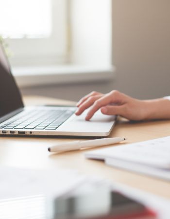 a person typing on a laptop