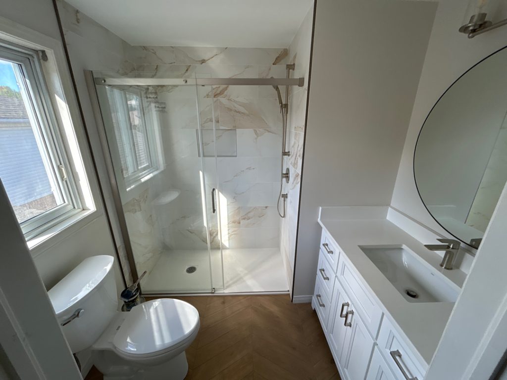 a bathroom with a shower and sink