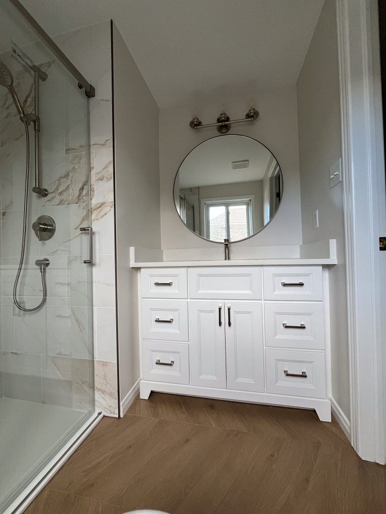 a bathroom with a mirror and shower