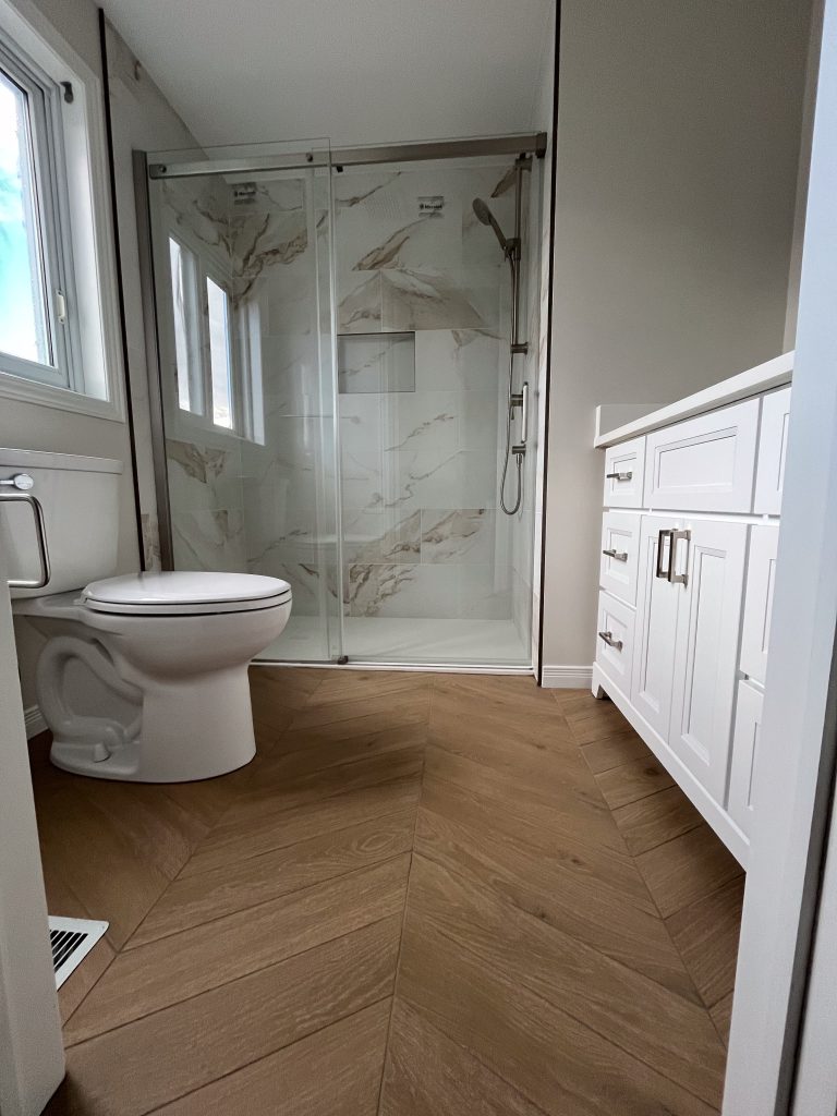 a bathroom with a toilet and shower